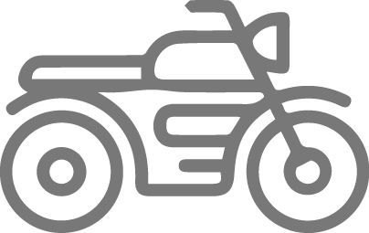 Gray icon of a motorcycle, representing transportation or travel.